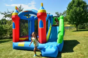 Castle Kids Party Theme Bounceland Royal Palace Inflatable Bounce House, elevation turbine with Long Slide, Large Bouncing Area, Basketball Hoop and Sun Roof, 13 ft x 12 ft x 9 ft H, UL Strong Certified Blower, 